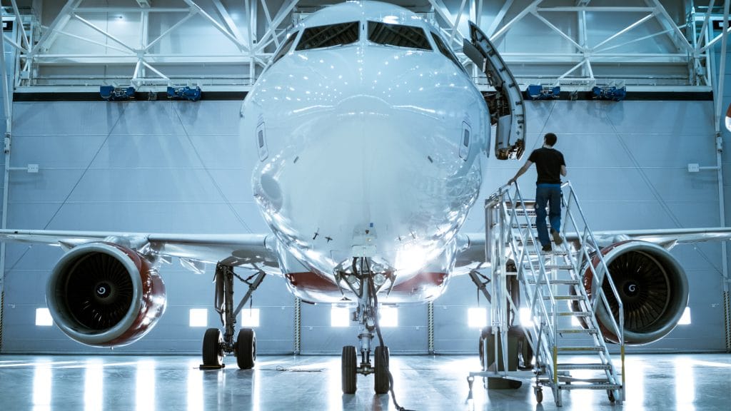 brand new airplane in aircraft hangar